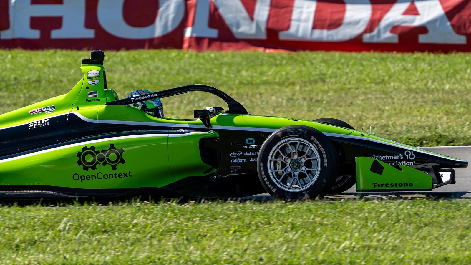 Josh Pierson în monopostul verde de Indy NXT la Mid-Ohio în iulie 2024