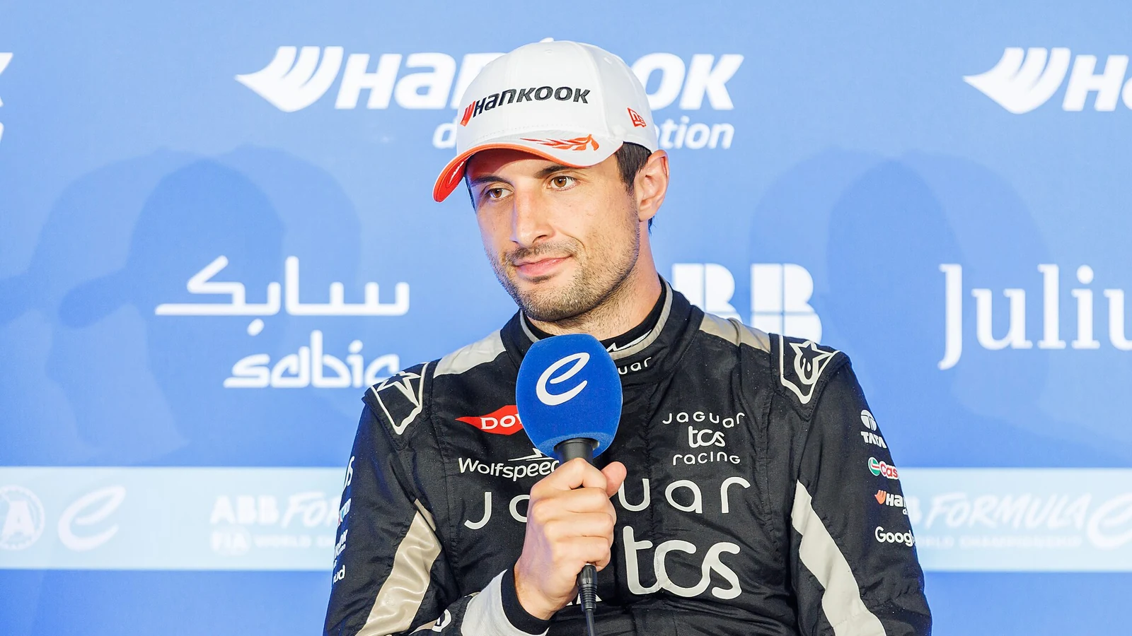 Mitch Evans being interviewed in Jaguar racewear at the 2025 Berlin E-Prix