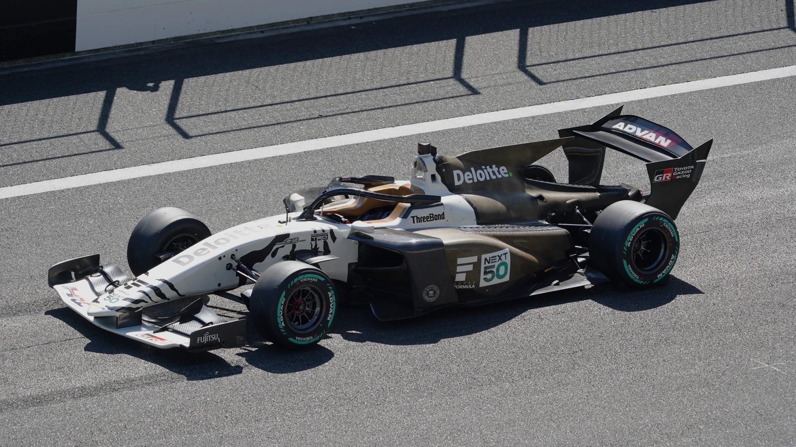 The black and white SF23 Shirotora development car at Fuji Speedway in 2024.