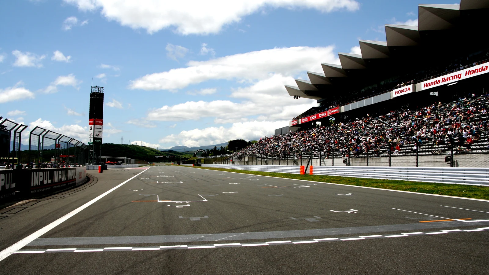 The Fuji Speedway start-finish straight and grandstands in a 2008 photograph.